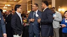 People speaking to each other at the event