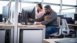 Two students in a computer lab